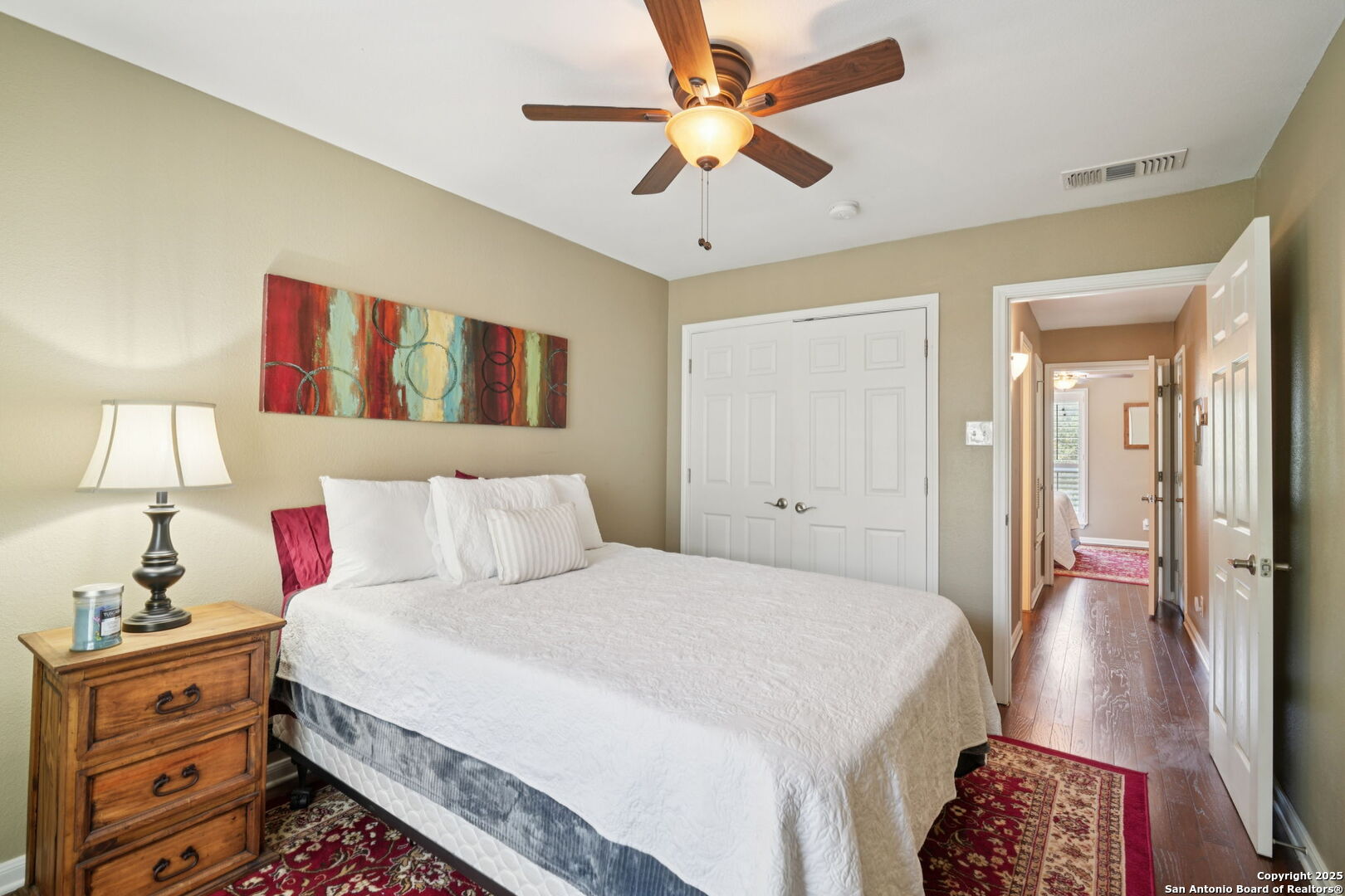 100 Lorenz Road, Unit 1204 San Antonio, TX 78209 - Photo 16 of 27 a spacious bedroom with a bed and a chandelier