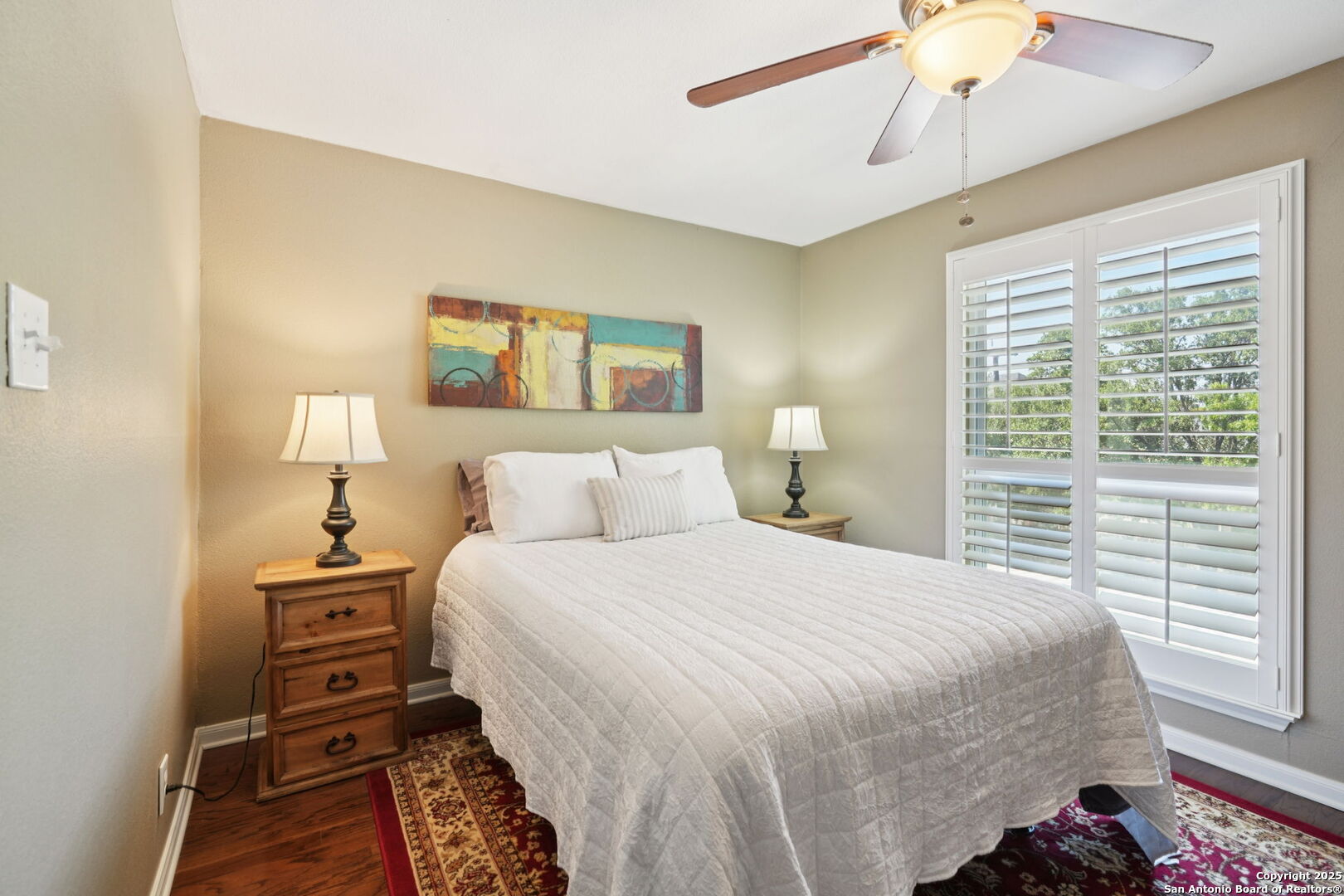 100 Lorenz Road, Unit 1204 San Antonio, TX 78209 - Photo 17 of 27 a bedroom with a bed and a chandelier