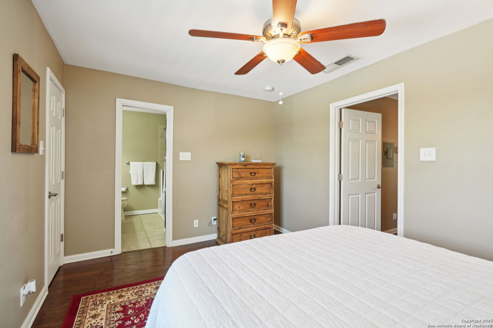 100 Lorenz Road, Unit 1204 San Antonio, TX 78209 - Photo 19 of 27 a bedroom with a bed and a dresser