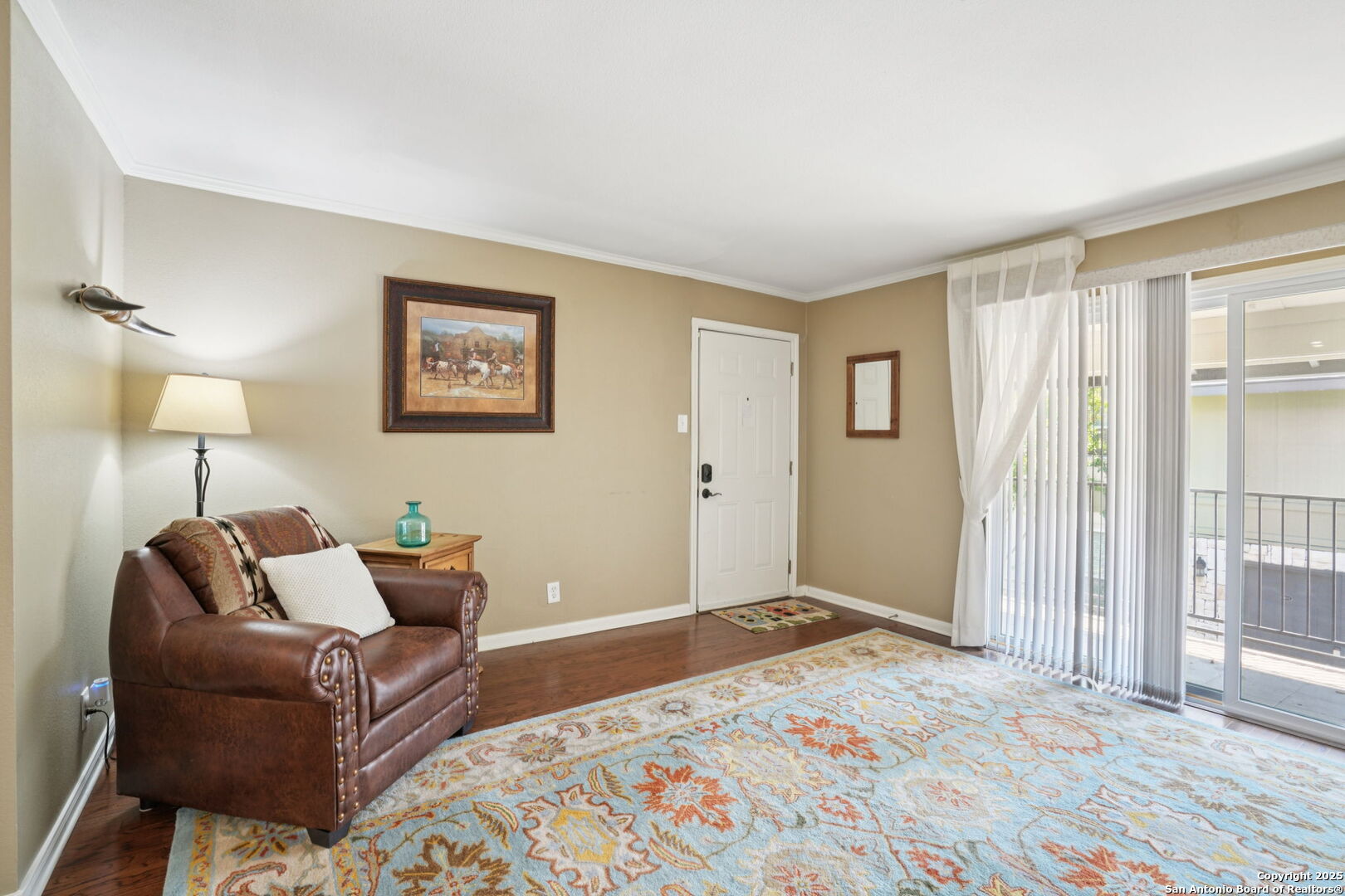 100 Lorenz Road, Unit 1204 San Antonio, TX 78209 - Photo 2 of 27 a bedroom with furniture and a lamp