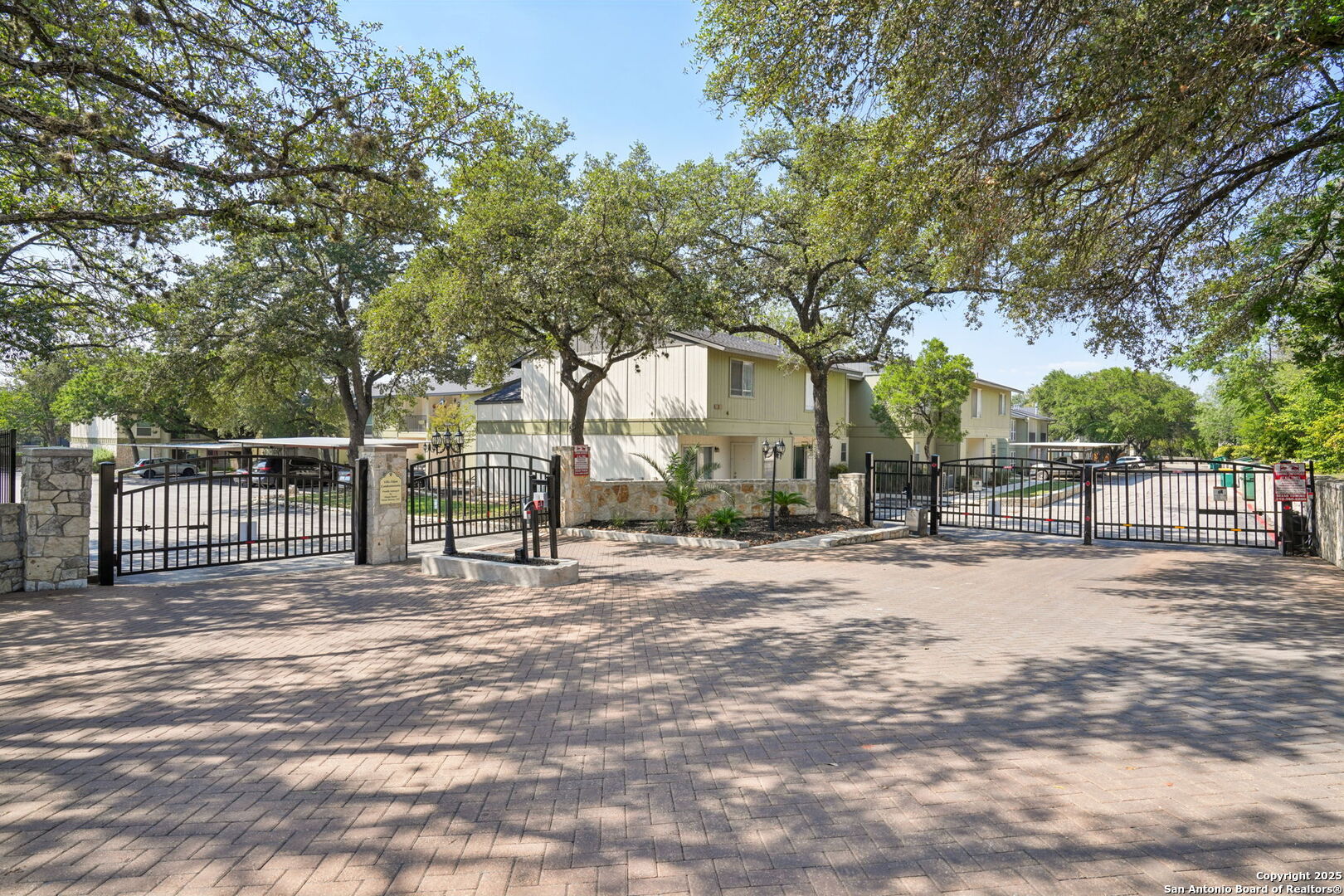 100 Lorenz Road, Unit 1204 San Antonio, TX 78209 - Photo 23 of 27 a view of a backyard with large trees