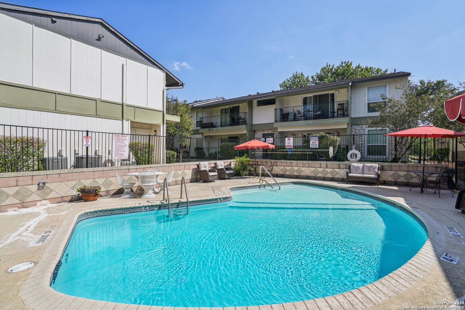 100 Lorenz Road, Unit 1204 San Antonio, TX 78209 - Photo 25 of 27 a swimming pool with outdoor seating and yard