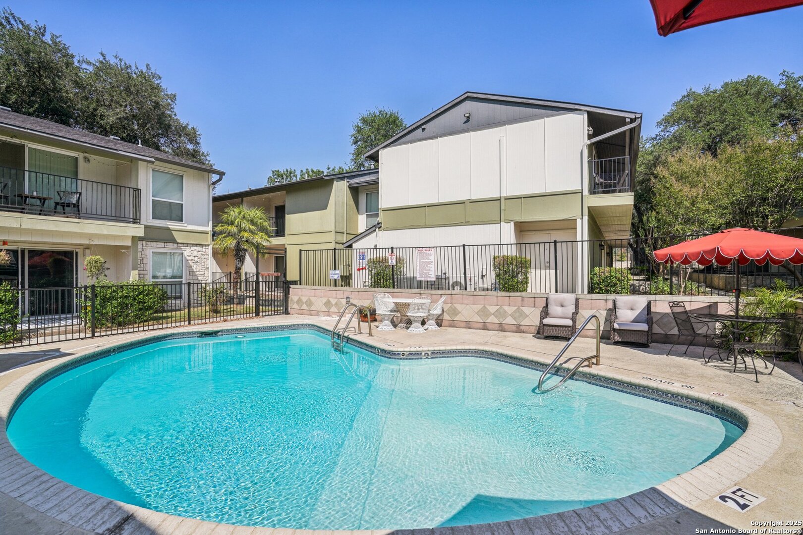 100 Lorenz Road, Unit 1204 San Antonio, TX 78209 - Photo 26 of 27 a view of a house with swimming pool and sitting area