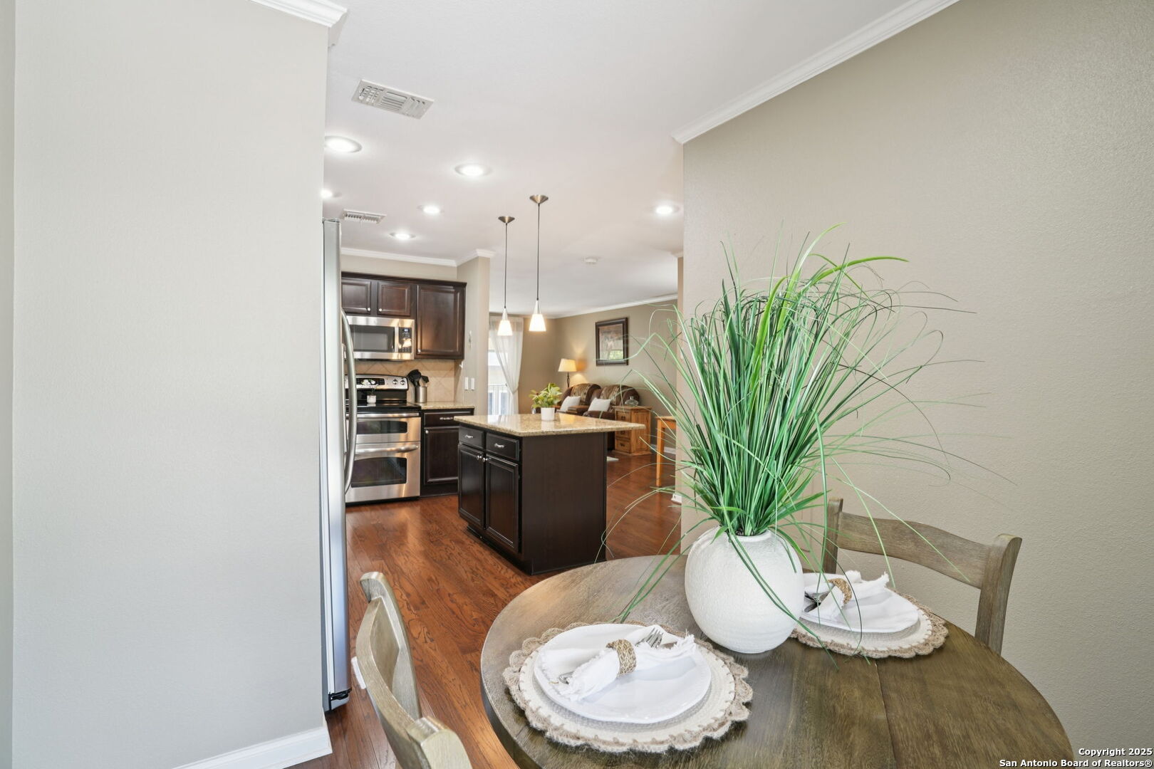 100 Lorenz Road, Unit 1204 San Antonio, TX 78209 - Photo 7 of 27 a dining room with furniture and wooden floor