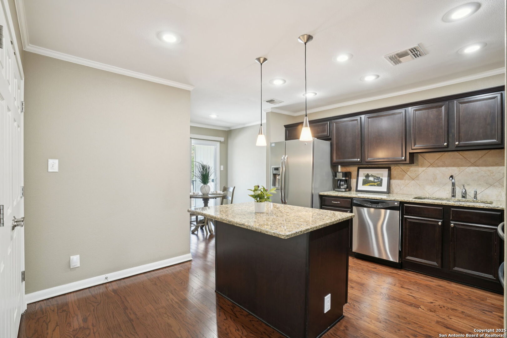 100 Lorenz Road, Unit 1204 San Antonio, TX 78209 - Photo 8 of 27 a kitchen with stainless steel appliances granite countertop a sink a stove and kitchen island