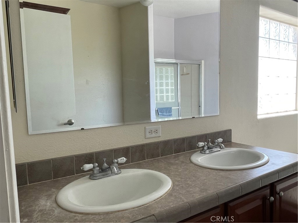 58735 Meyers Lane Anza, CA 92539 - Photo 17 of 18 a bathroom with double sink and a mirror
