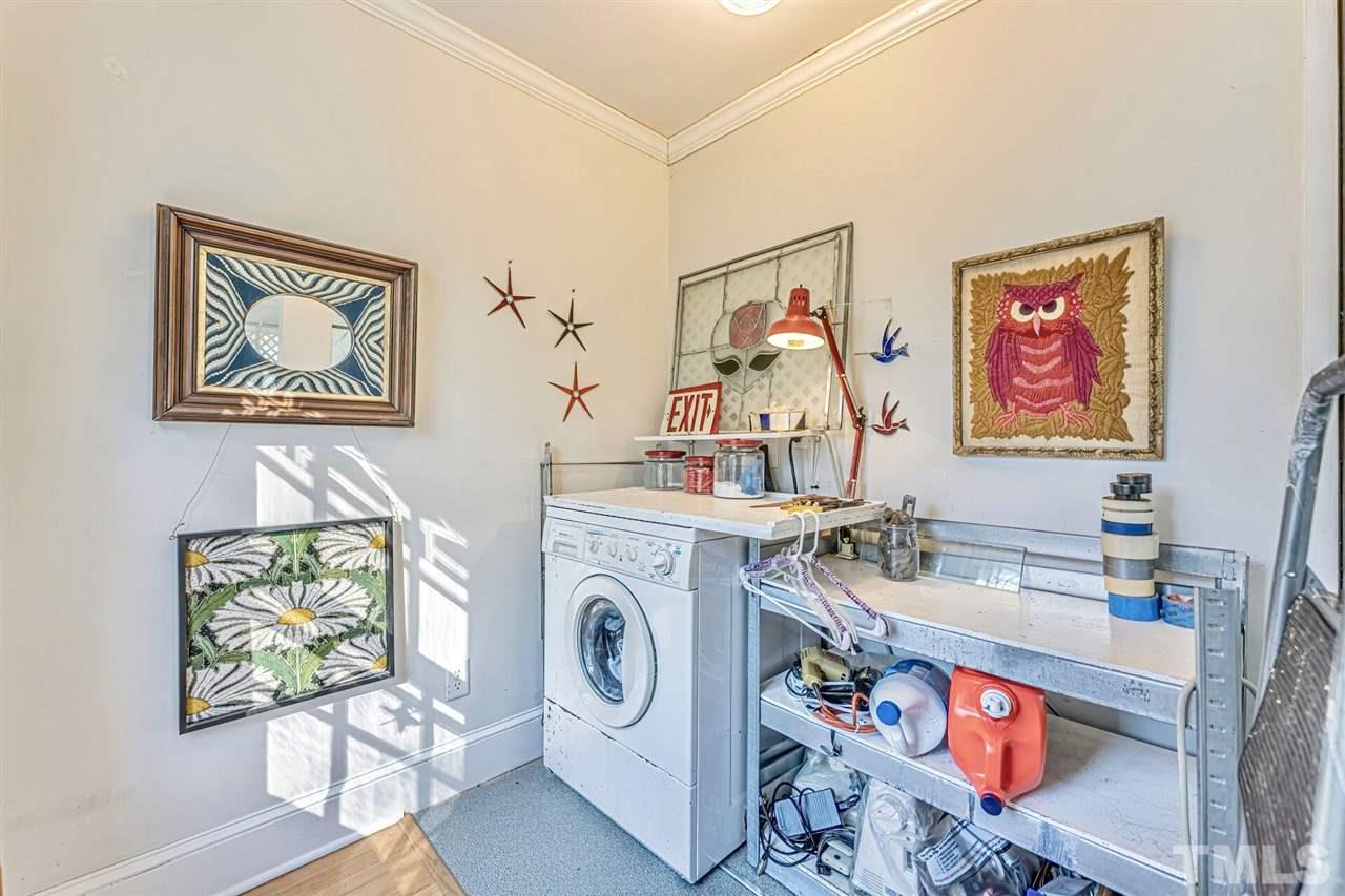 409 North King Charles Road Raleigh, NC 27610 - Photo 22 of 30 a view of a workspace with furniture and toys
