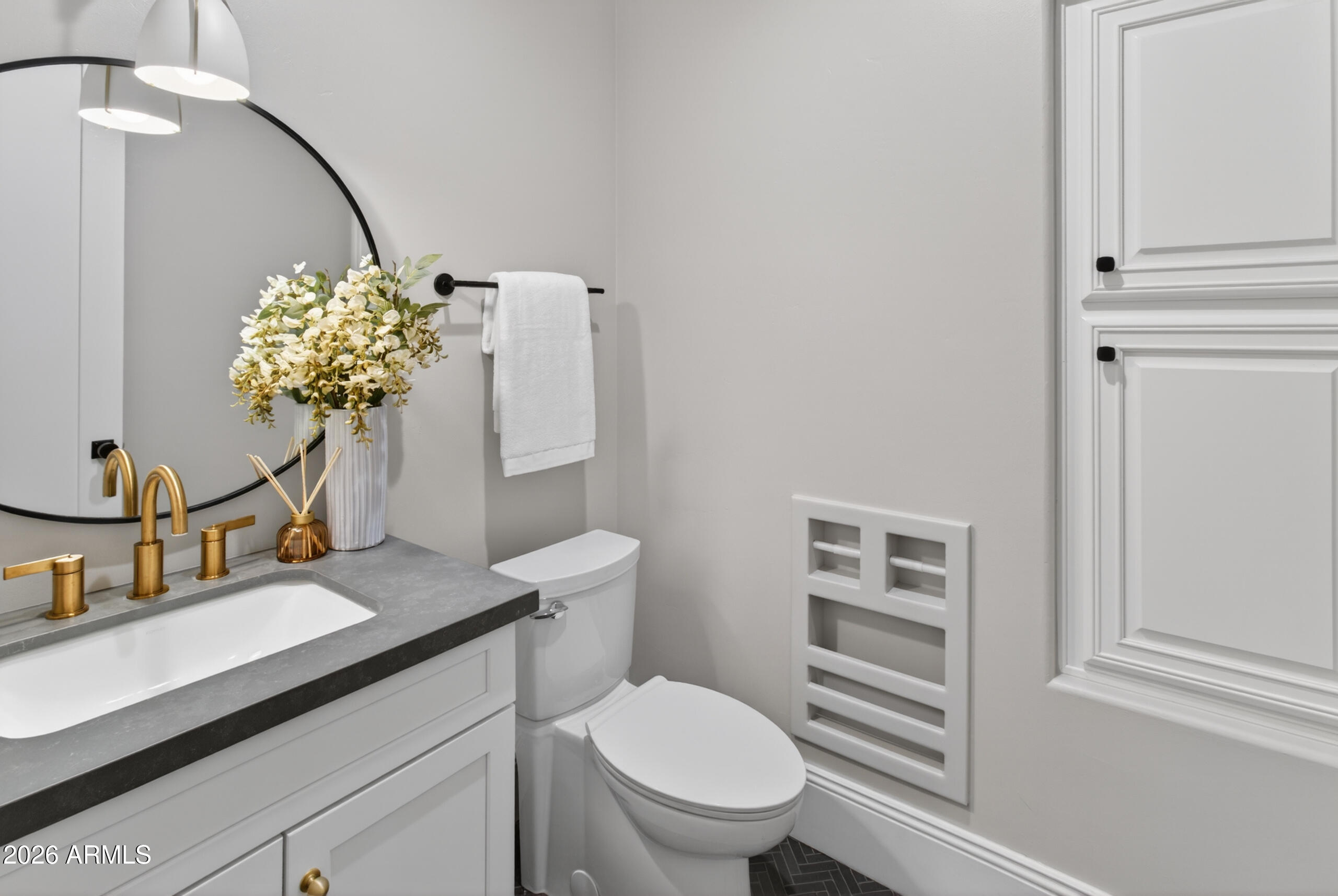 2677 East Queen Creek Road Gilbert, AZ 85297 - Photo 56 of 128 a bathroom with a toilet sink and mirror