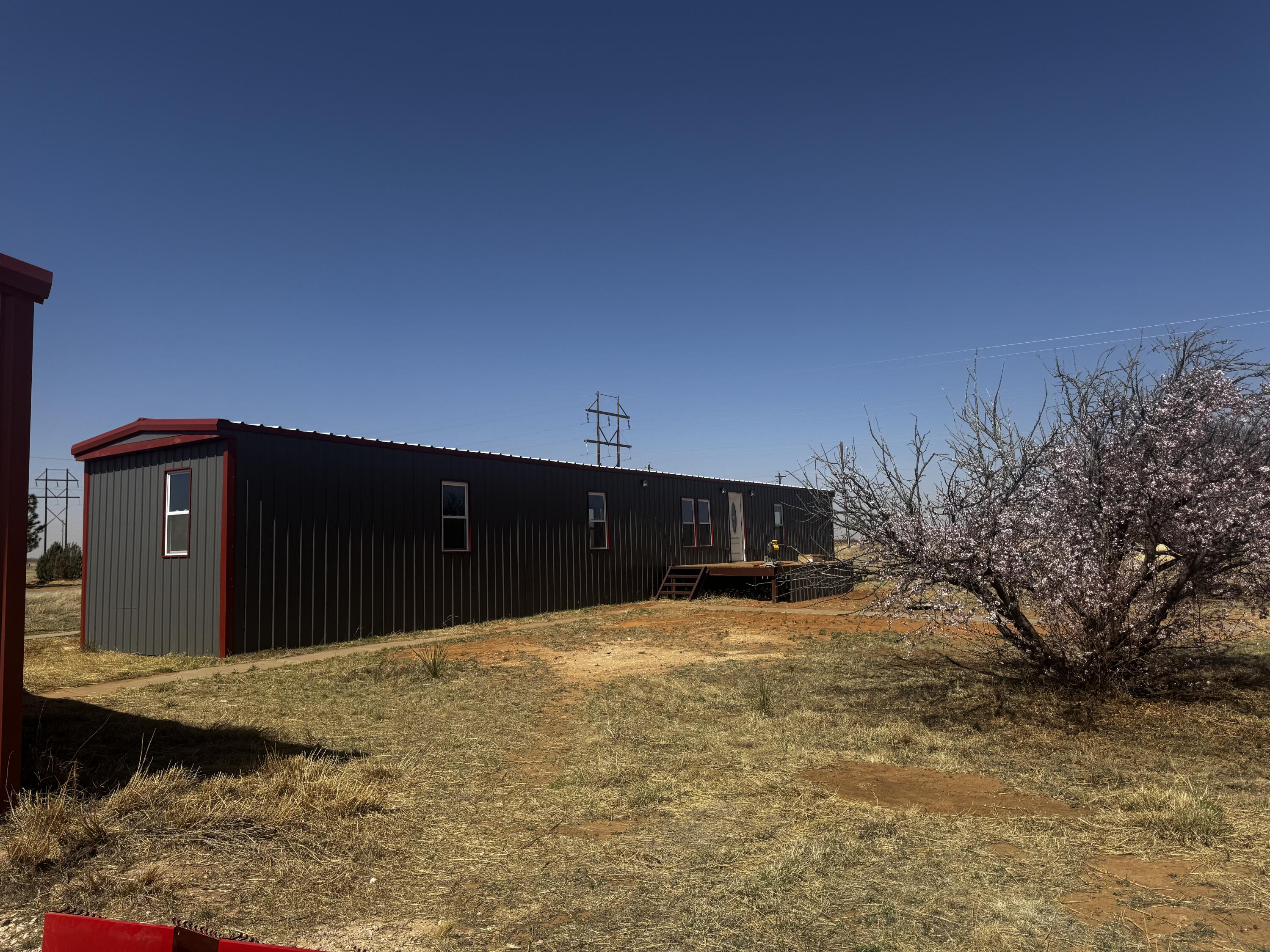1128 Alaska Road Levelland, TX 79336 - Photo 2 of 20 a front view of a house with a yard