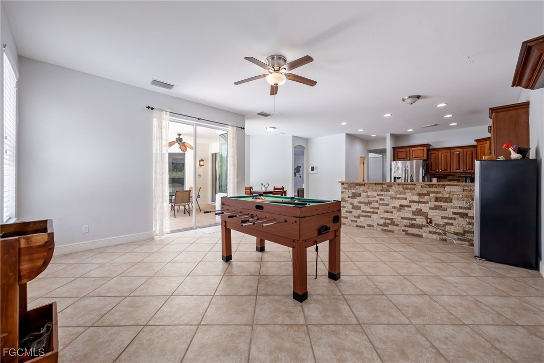 12406 Rock Ridge Lane Fort Myers, FL 33913 - Photo 12 of 35 a room with a table and chairs