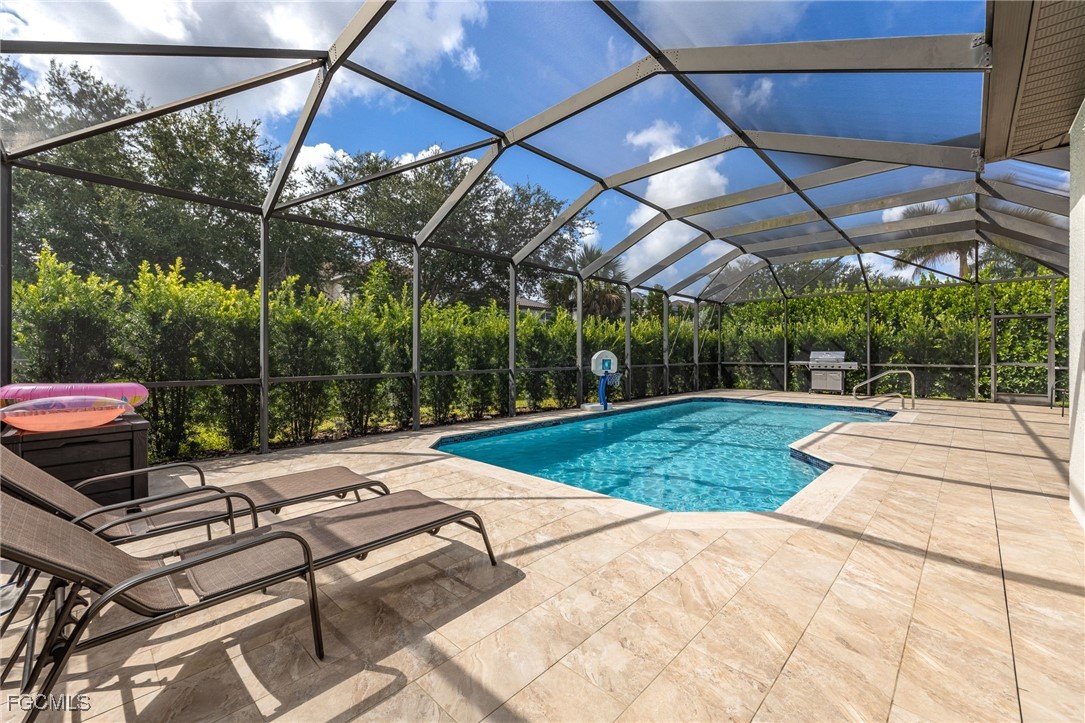 12406 Rock Ridge Lane Fort Myers, FL 33913 - Photo 24 of 35 a view of a backyard with chairs and a small yard