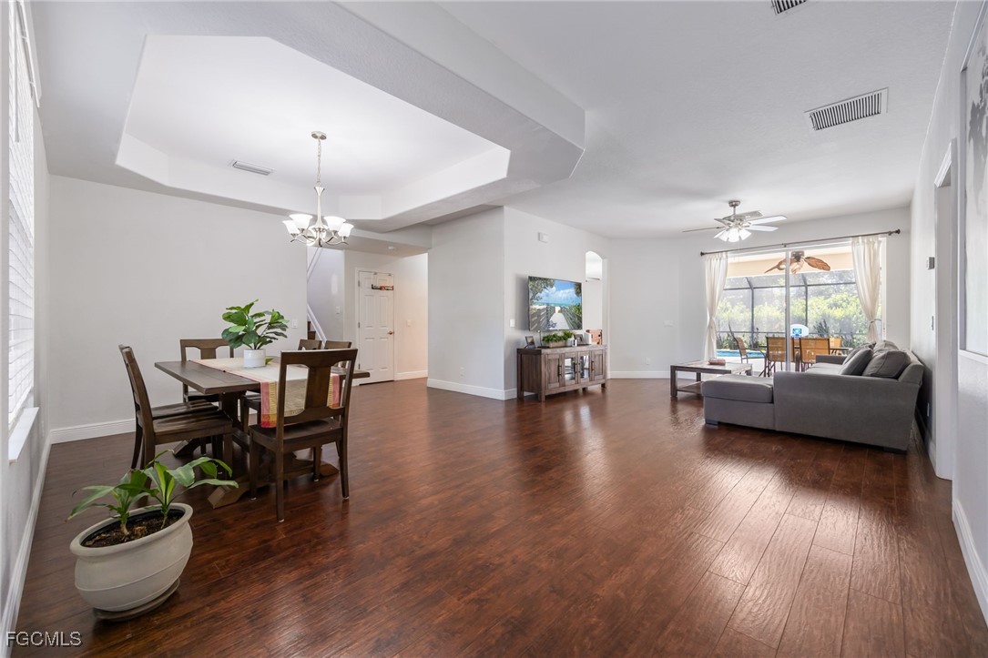 12406 Rock Ridge Lane Fort Myers, FL 33913 - Photo 5 of 35 a living room with furniture and a wooden floor