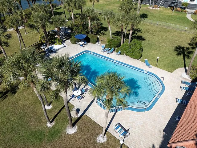a view of a swimming pool with a yard