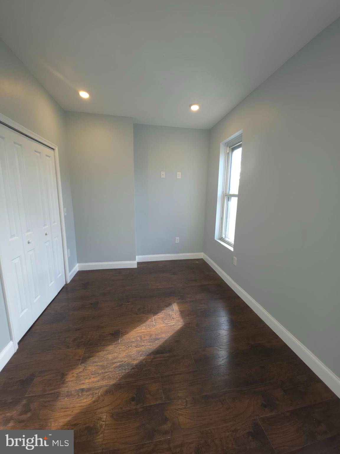 1135 West Somerset Street, Unit 2 Philadelphia, PA 19133 - Photo 12 of 15 a view of empty room with wooden floor and fan