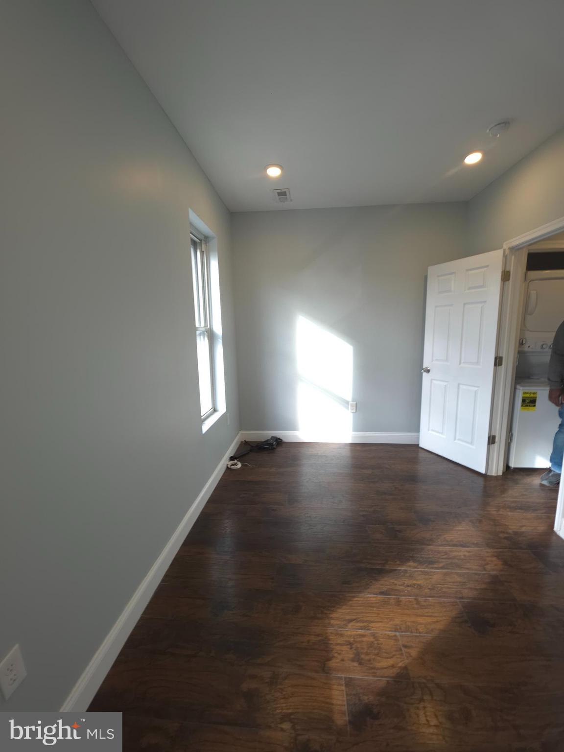 1135 West Somerset Street, Unit 2 Philadelphia, PA 19133 - Photo 13 of 15 a view of empty room with wooden floor and fan