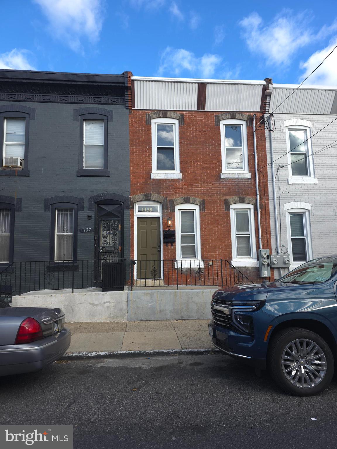 1135 West Somerset Street, Unit 2 Philadelphia, PA 19133 - Photo 15 of 15 a front view of a house with parking space