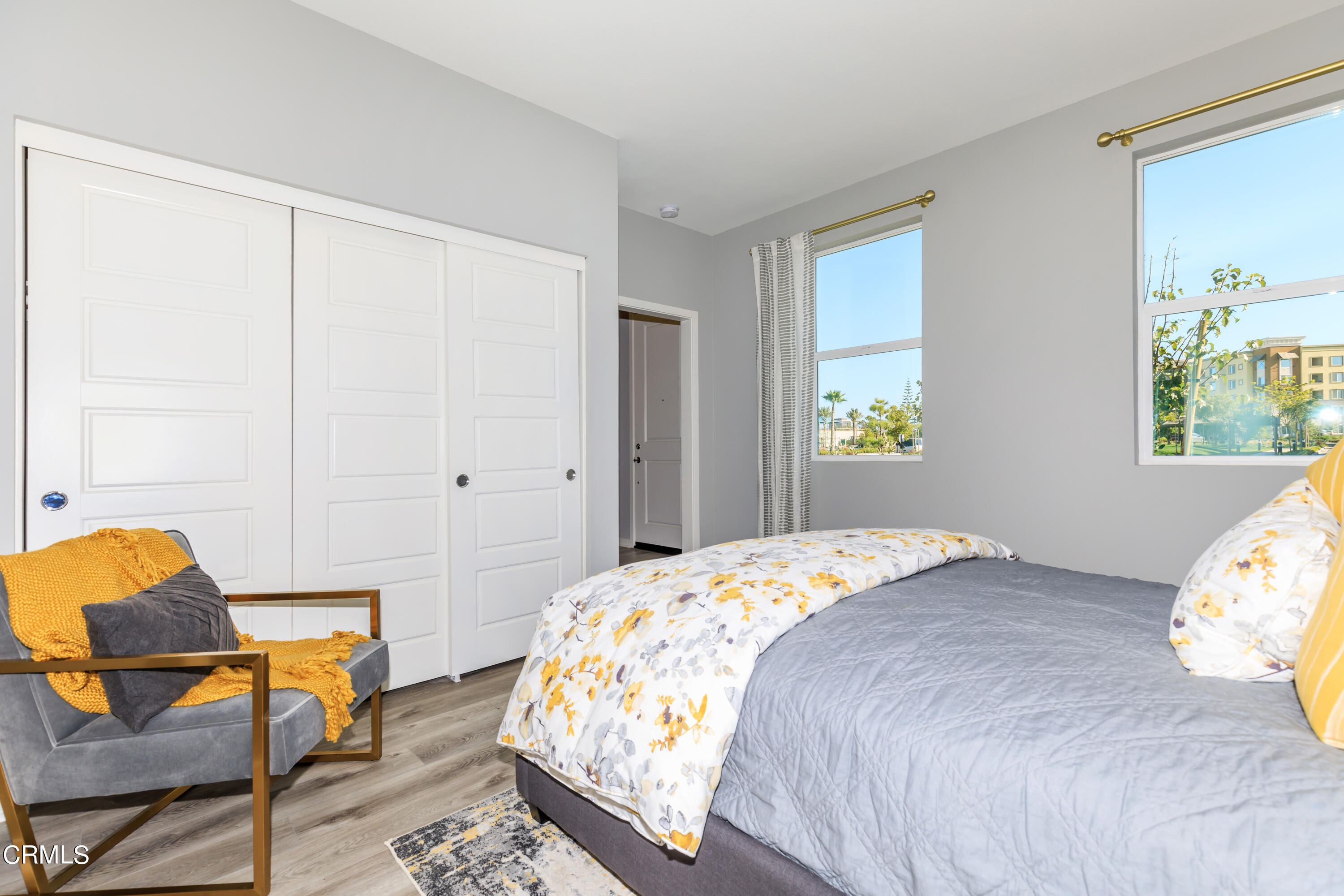 703 Winchester Drive Oxnard, CA 93036 - Photo 16 of 30 a bedroom with a bed and chair