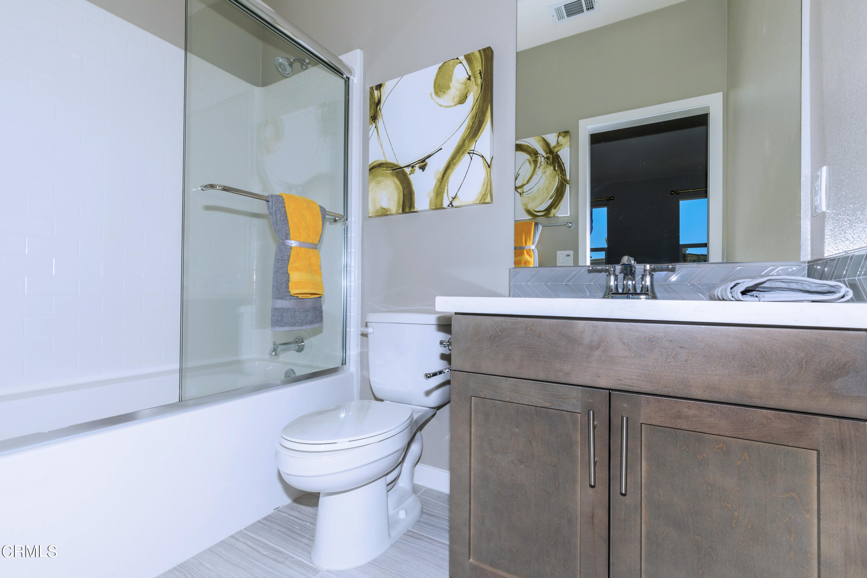 703 Winchester Drive Oxnard, CA 93036 - Photo 17 of 30 a bathroom with a toilet sink and mirror