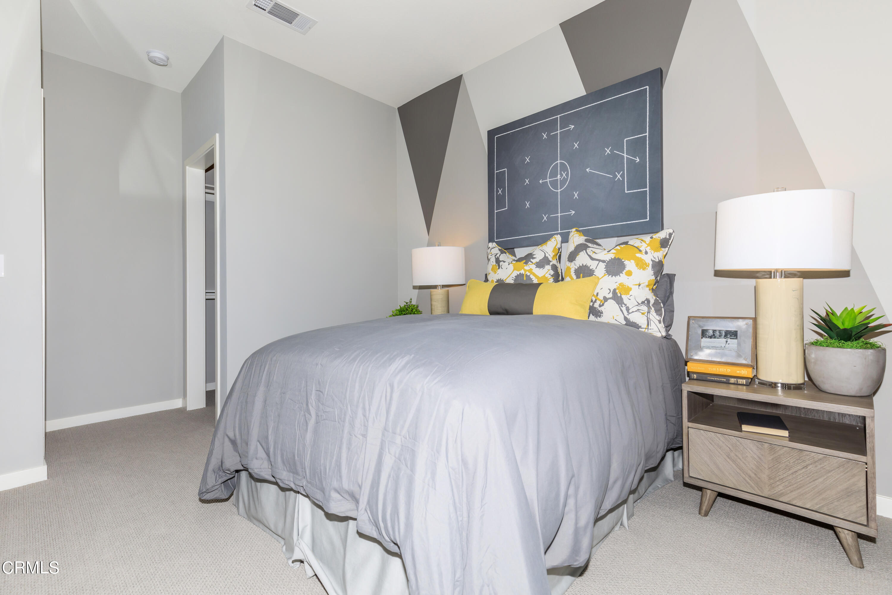 703 Winchester Drive Oxnard, CA 93036 - Photo 24 of 30 a bed sitting in a bedroom next to a lamp