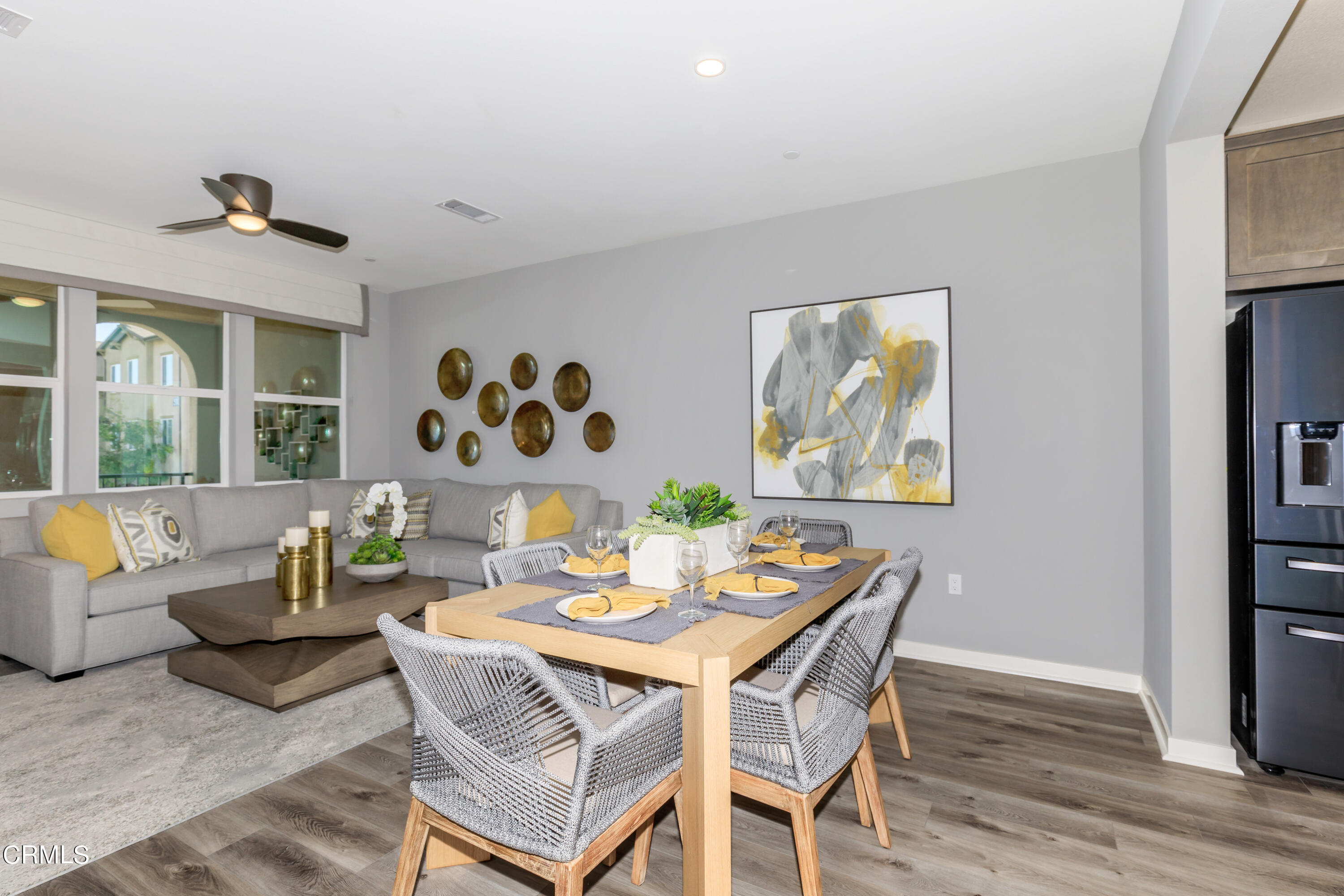 703 Winchester Drive Oxnard, CA 93036 - Photo 8 of 30 a view of a dining room with furniture a rug and wooden floor