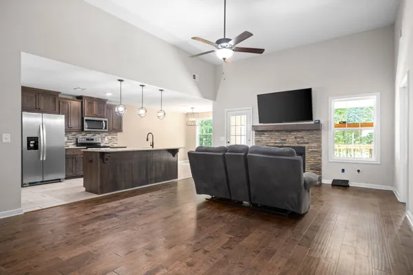 a living room with furniture and a flat screen tv