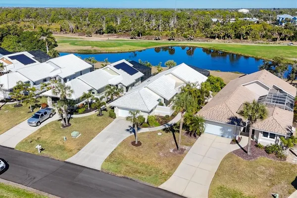 an aerial view of a house with a swimming pool