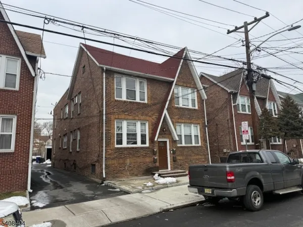 a view of a car park in front of house