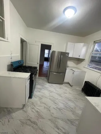 a bedroom with a bed and a cabinets