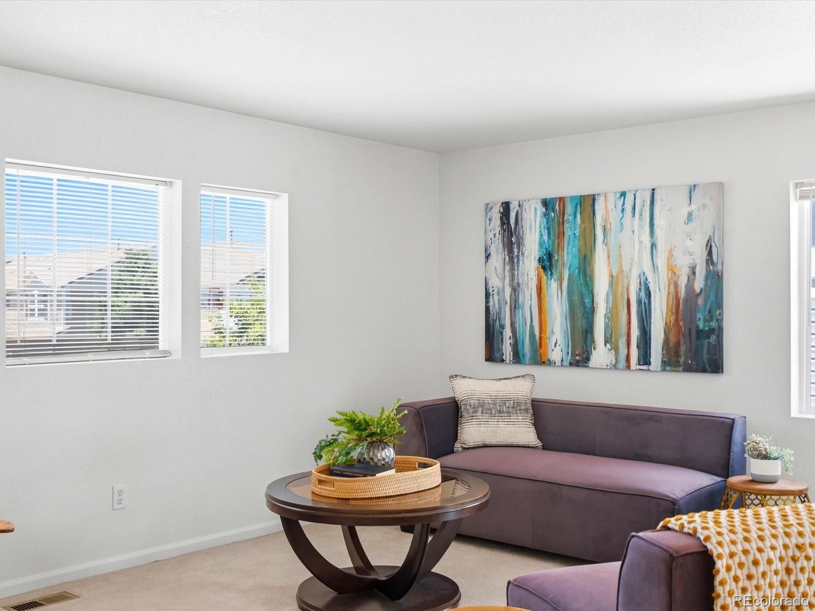 5444 Perth Court Denver, CO 80249 - Photo 21 of 46 a living room with furniture and a window