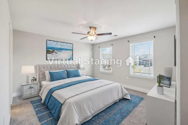 a bedroom with a large bed and a window