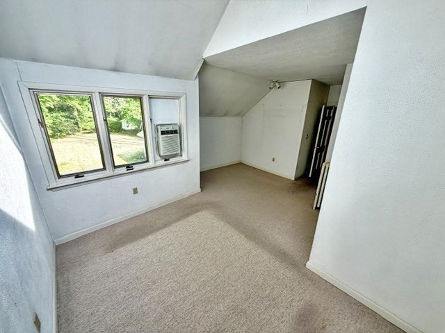 60 Massasoit Street Northampton, MA 01060 - Photo 12 of 19 an empty room with windows and mirror