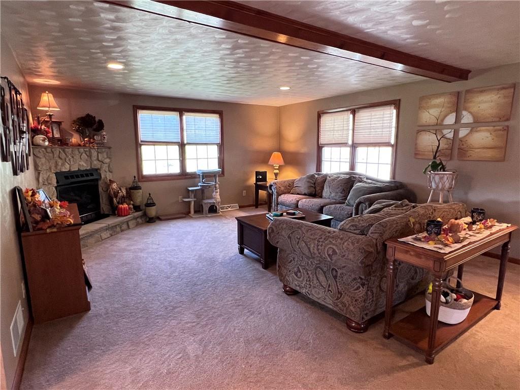 822 Old State Road Apollo, PA 15613 - Photo 11 of 28 a living room with furniture a fireplace and a large window