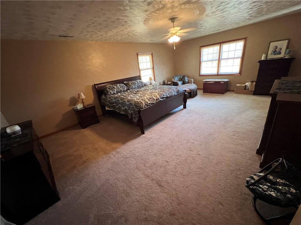 822 Old State Road Apollo, PA 15613 - Photo 15 of 28 a bedroom with a bed and a couch