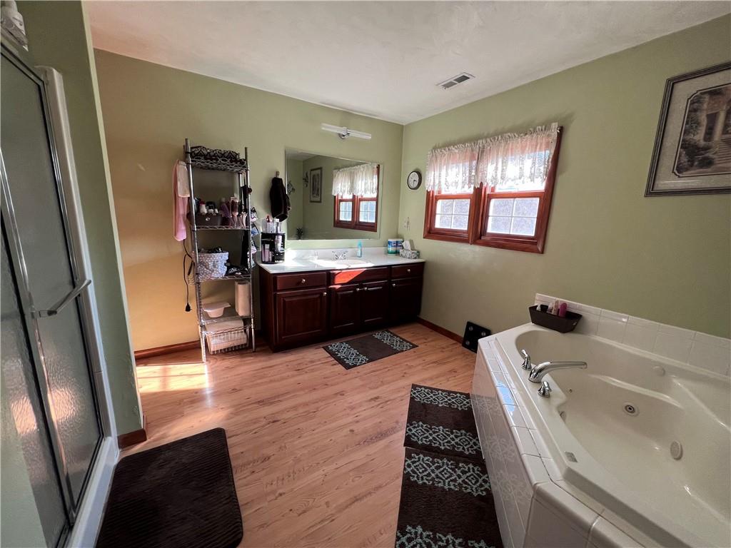 822 Old State Road Apollo, PA 15613 - Photo 17 of 28 a bathroom with a tub sink and mirror