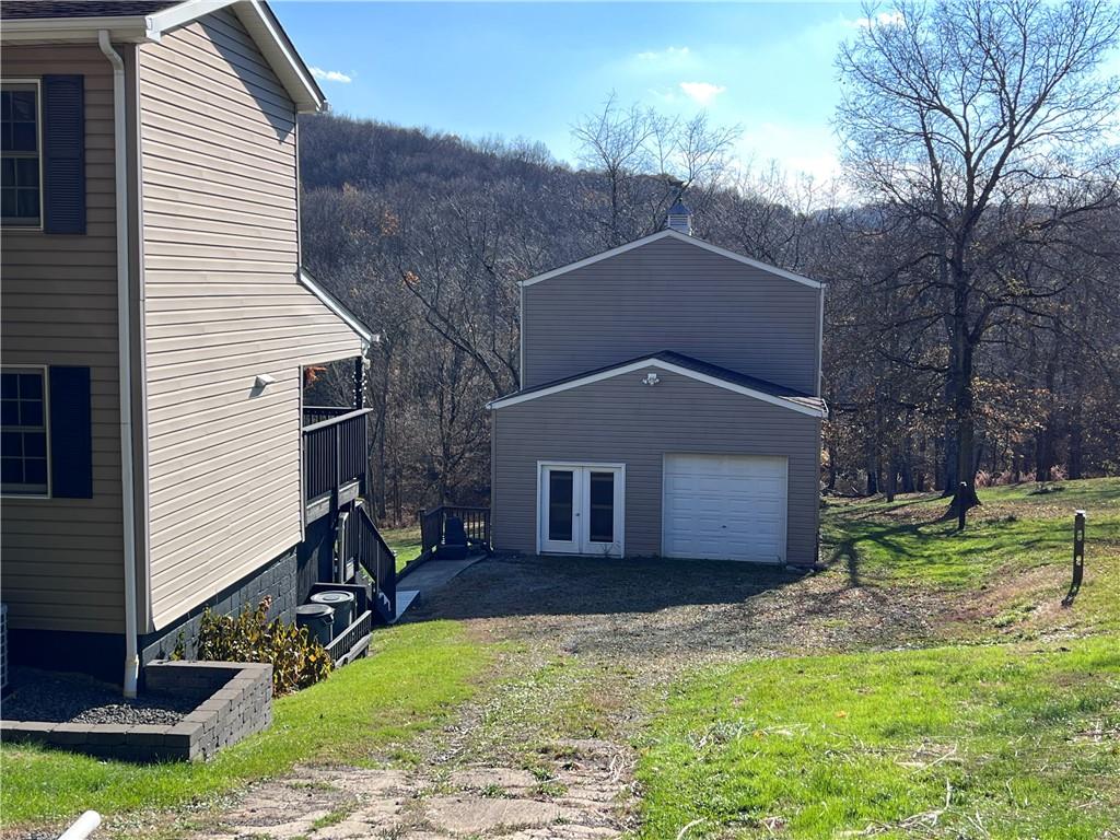 822 Old State Road Apollo, PA 15613 - Photo 23 of 28 a front view of a house with a yard