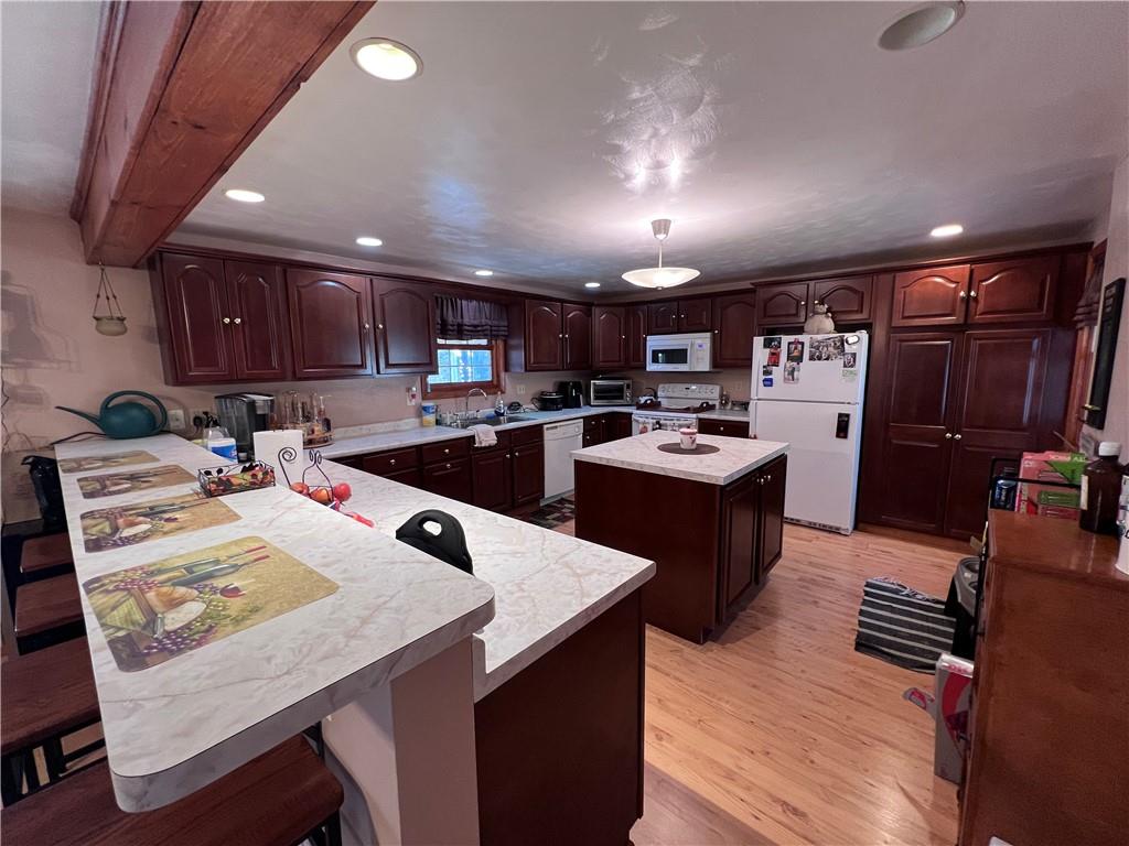 822 Old State Road Apollo, PA 15613 - Photo 5 of 28 a kitchen with stainless steel appliances kitchen island granite countertop a sink refrigerator and cabinets