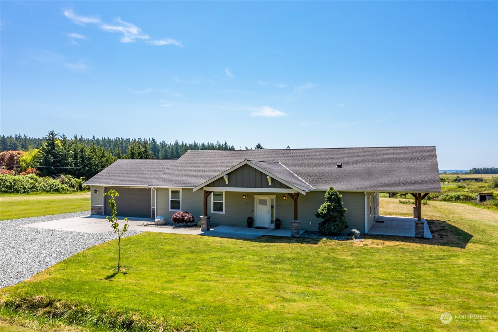 11 West Green Valley Road Oak Harbor, WA 98277 - Photo 1 of 36 a front view of house and swimming pool with seating space