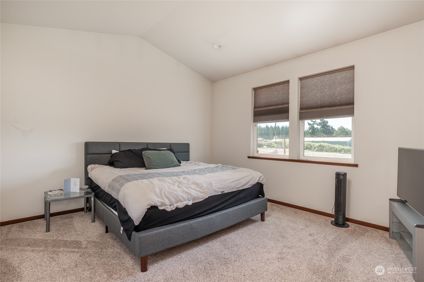 11 West Green Valley Road Oak Harbor, WA 98277 - Photo 12 of 36 a bed sitting in a bedroom next to a window
