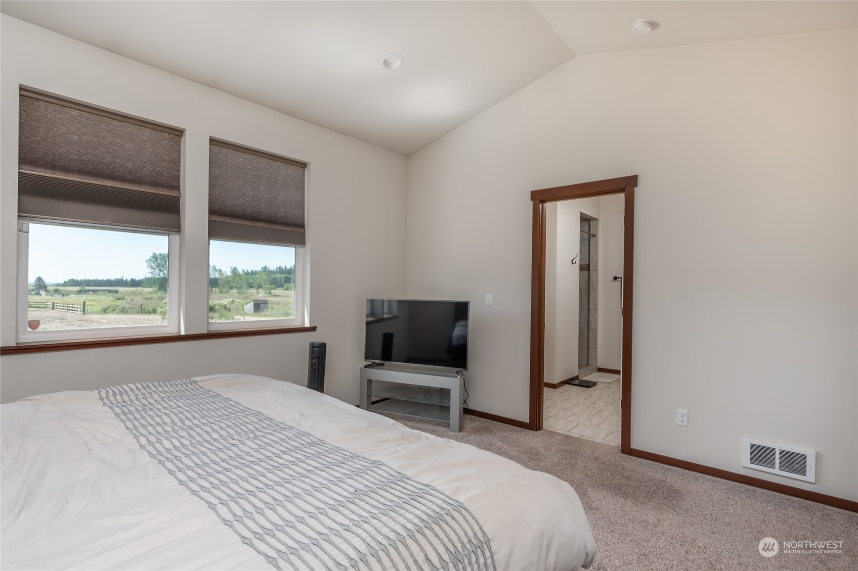 11 West Green Valley Road Oak Harbor, WA 98277 - Photo 13 of 36 a bedroom with a bed and a large window