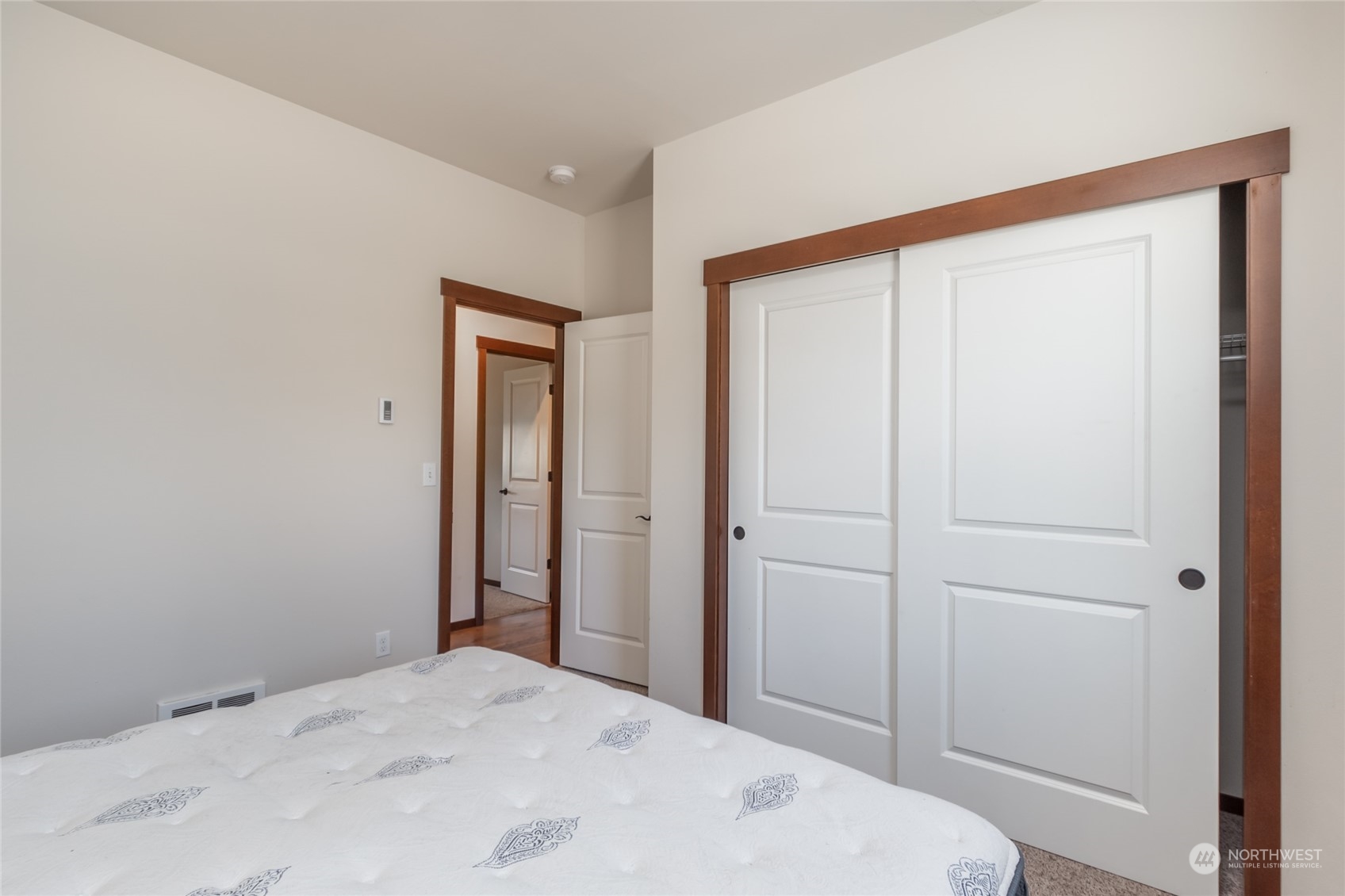 11 West Green Valley Road Oak Harbor, WA 98277 - Photo 17 of 36 a bedroom with a bed and a mirror