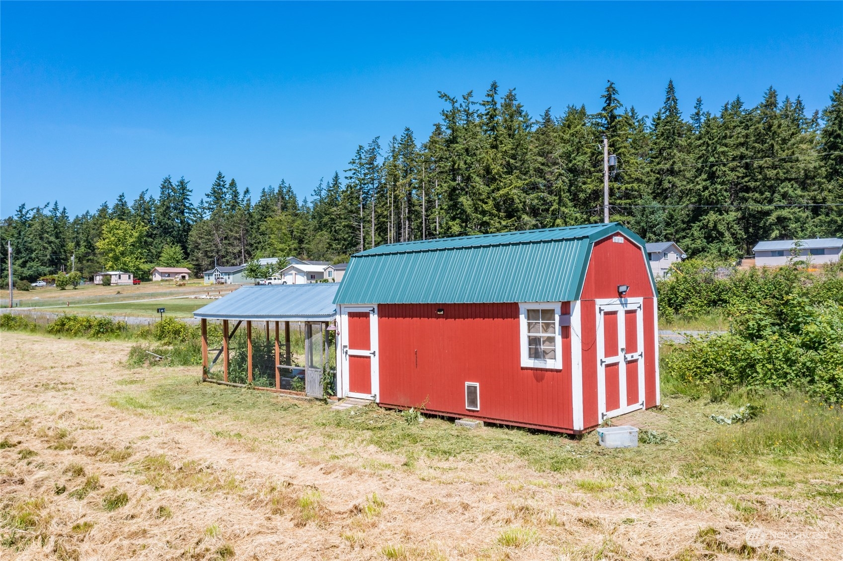 11 West Green Valley Road Oak Harbor, WA 98277 - Photo 29 of 36 a backyard of a house with a yard and outdoor seating