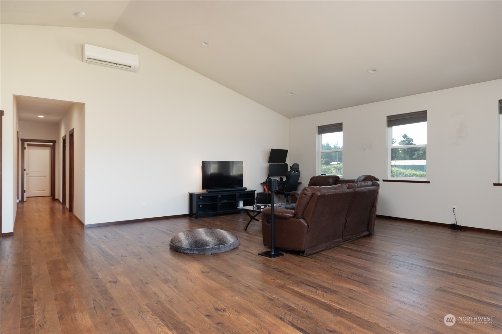 11 West Green Valley Road Oak Harbor, WA 98277 - Photo 10 of 36 a living room with furniture and a flat screen tv