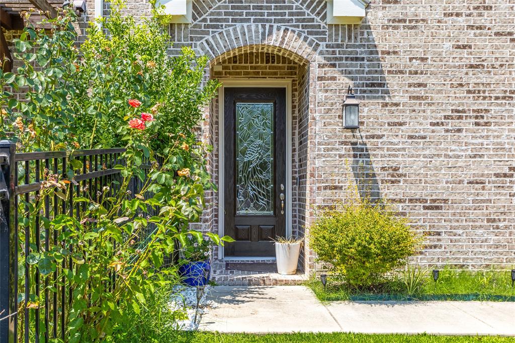 464 Renaissance Lane Irving, TX 75060 - Photo 2 of 31 a front view of a house with a yard