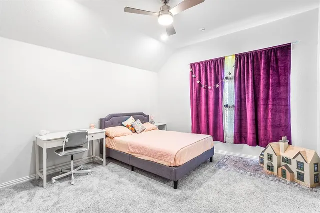 a a bedroom with a bed and a chair