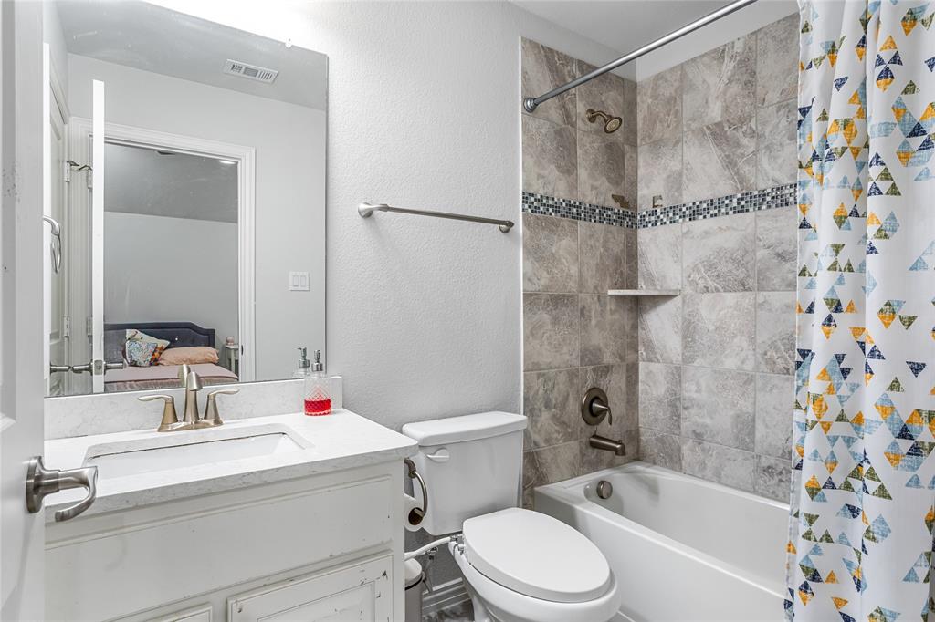 464 Renaissance Lane Irving, TX 75060 - Photo 26 of 31 a bathroom with a sink toilet and shower