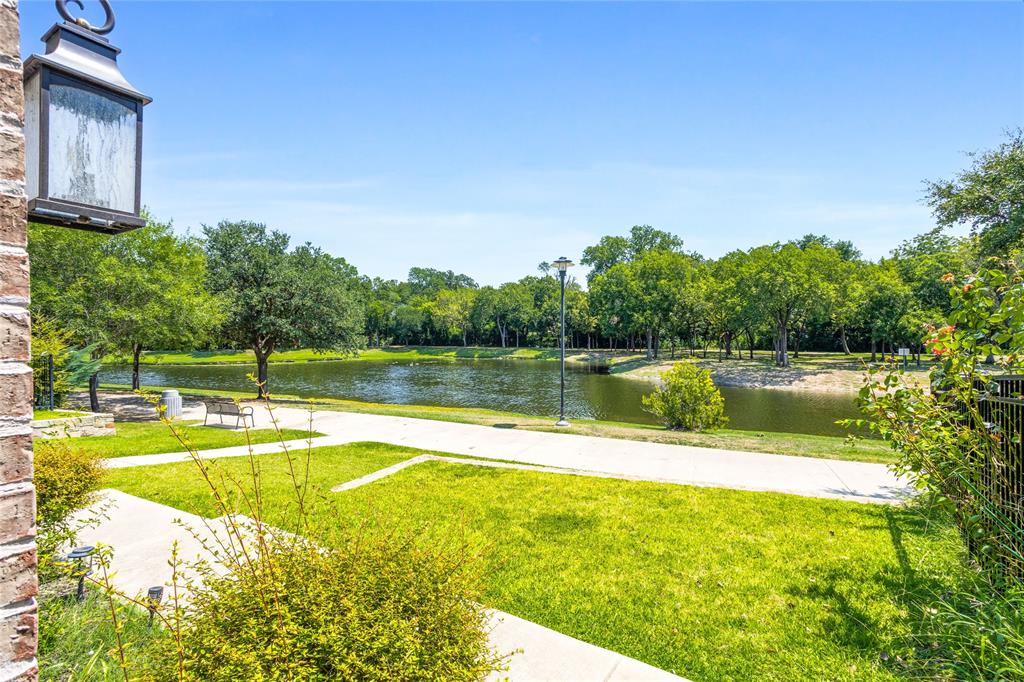 464 Renaissance Lane Irving, TX 75060 - Photo 31 of 31 a view of a swimming pool with a lake view