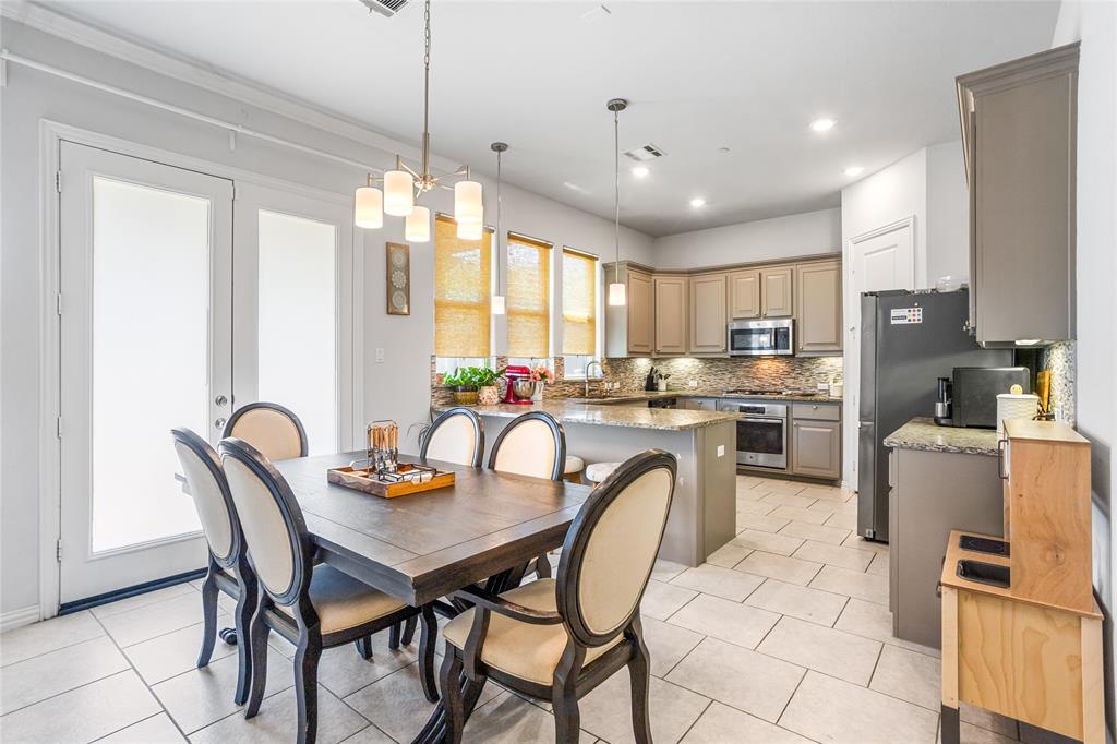 464 Renaissance Lane Irving, TX 75060 - Photo 8 of 31 a view of a dining room and livingroom with furniture wooden floor a chandelier