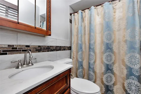 a view of a hallway with washer and dryer