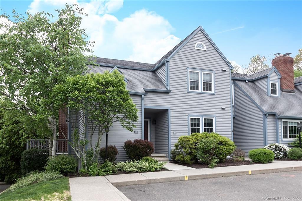 87 Gate Ridge Road, Unit 87 Fairfield, CT 06825 - Photo 1 of 1 a front view of a house with a yard
