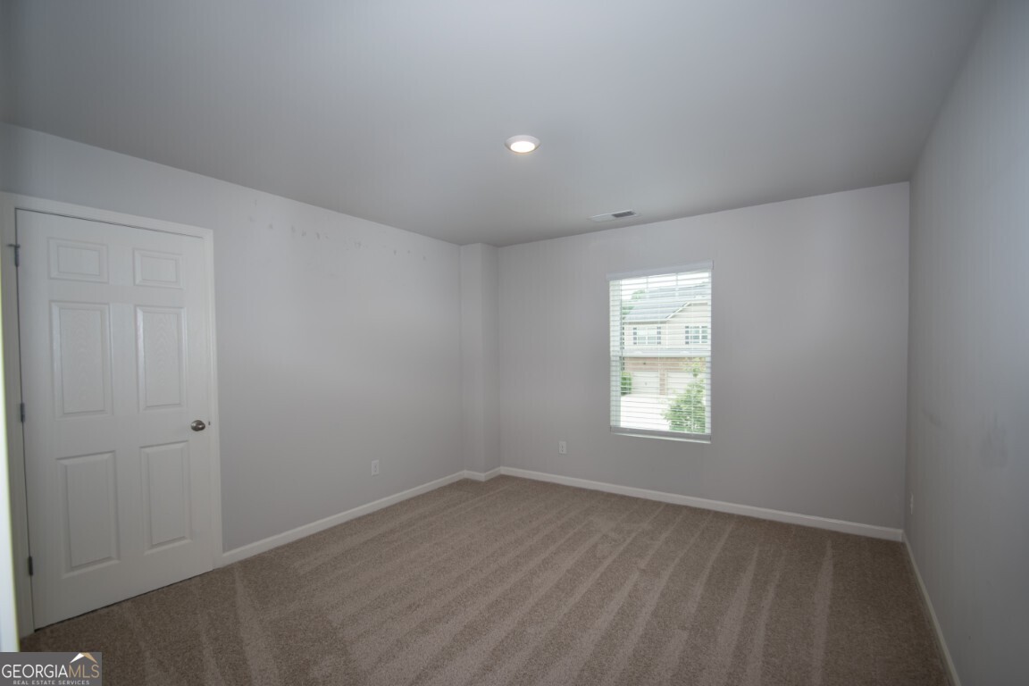 8084 Louis Drive Locust Grove, GA 30248 - Photo 21 of 44 an empty room with a window